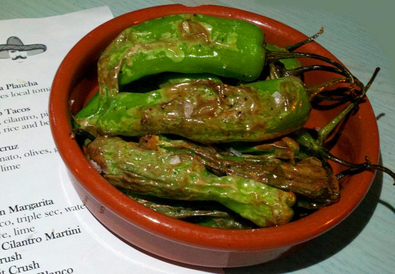Mild and friendly shishito peppers can be drizzled with a good olive oil, blistered on an open flame and sprinkled with kosher salt. Though they might look dangerous, they are quite tame. Spice wimps can order them with impunity to impress their chilihead friends. BOB YESBEK PHOTO